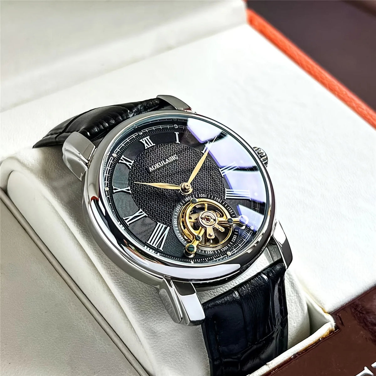 Men's automatic mechanical watch with dark blue dial, gold-toned open movement, black strap