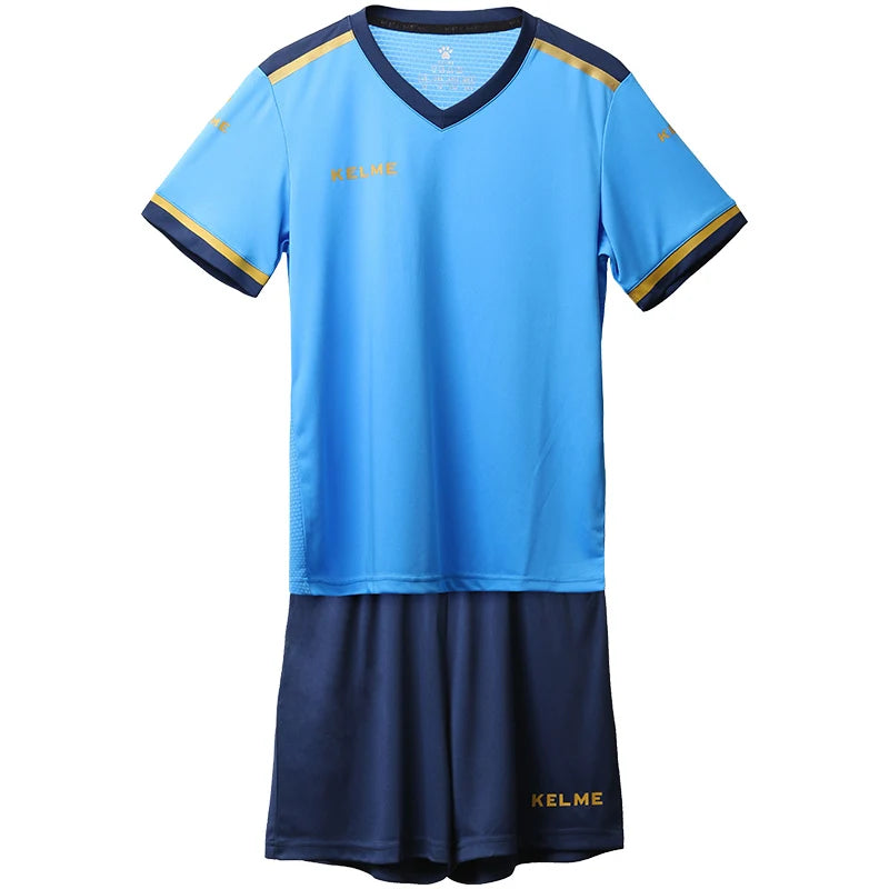 Kids blue soccer jersey with V-neck and yellow trim, matching navy shorts, KELME logo