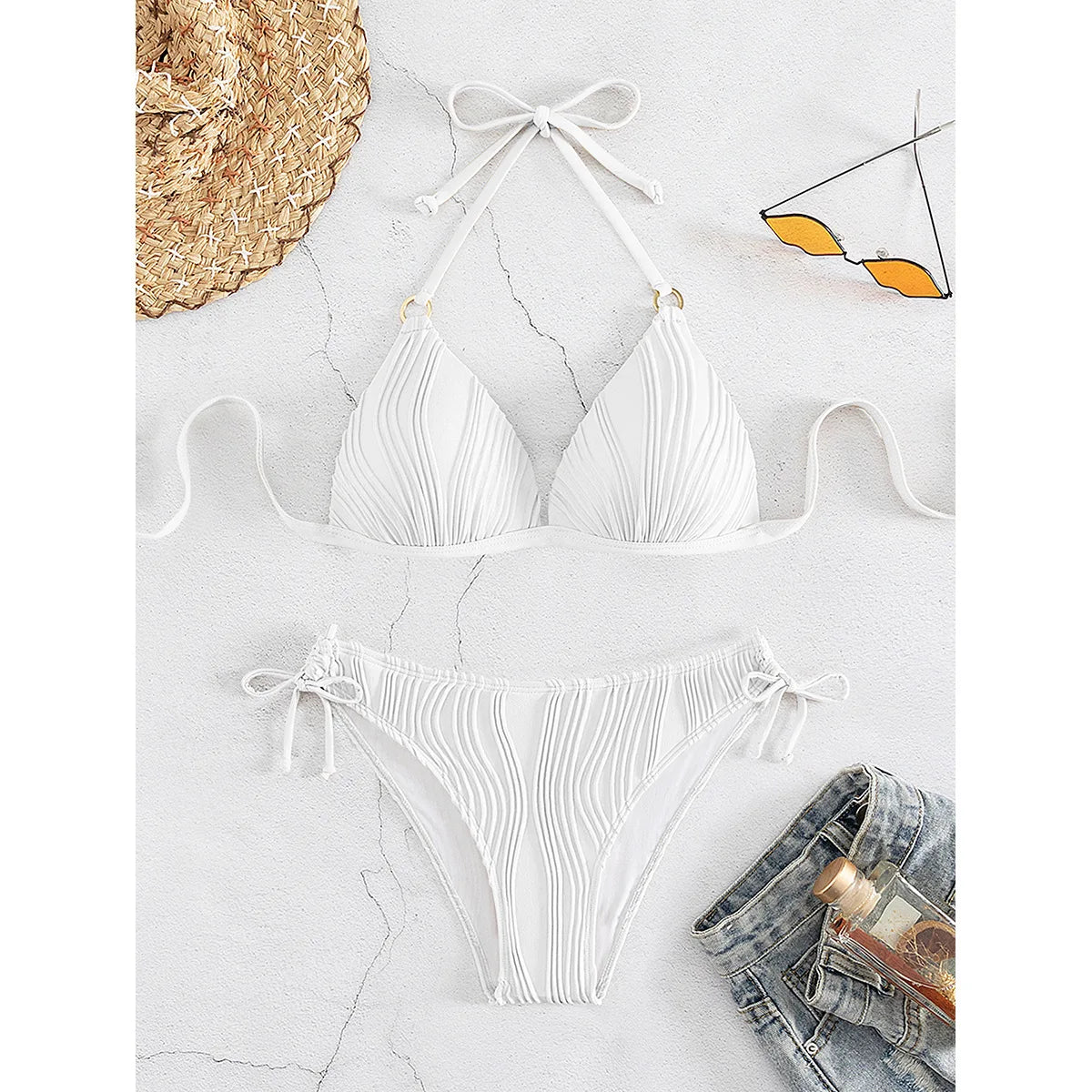 Women's white ribbed bikini set, triangle top with tie straps and drawstring high-cut bottoms.