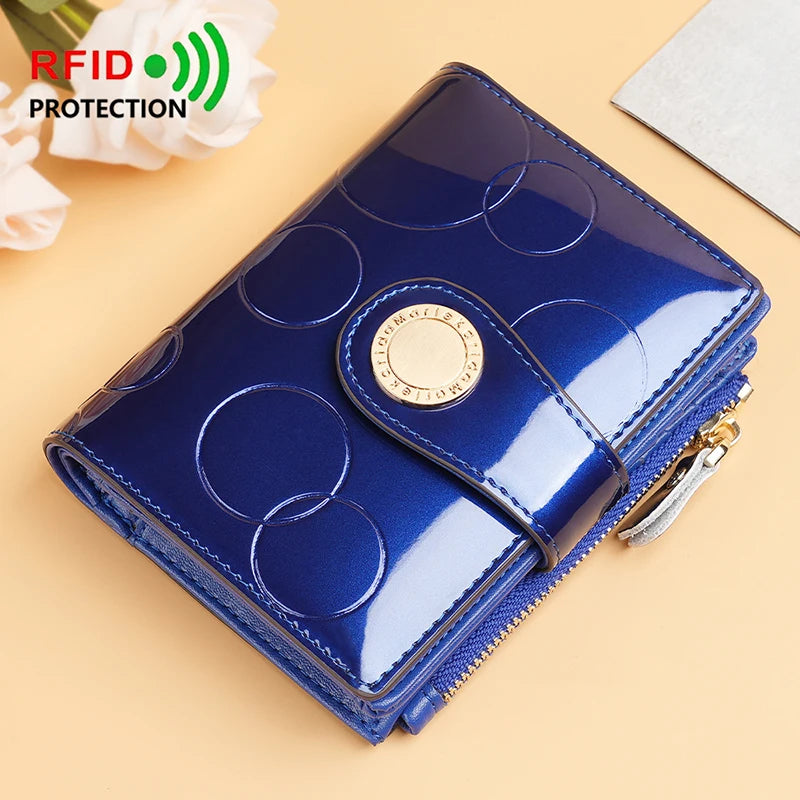 Blue glossy short wallet with gold round logo, zipper closure, and embossed circle pattern