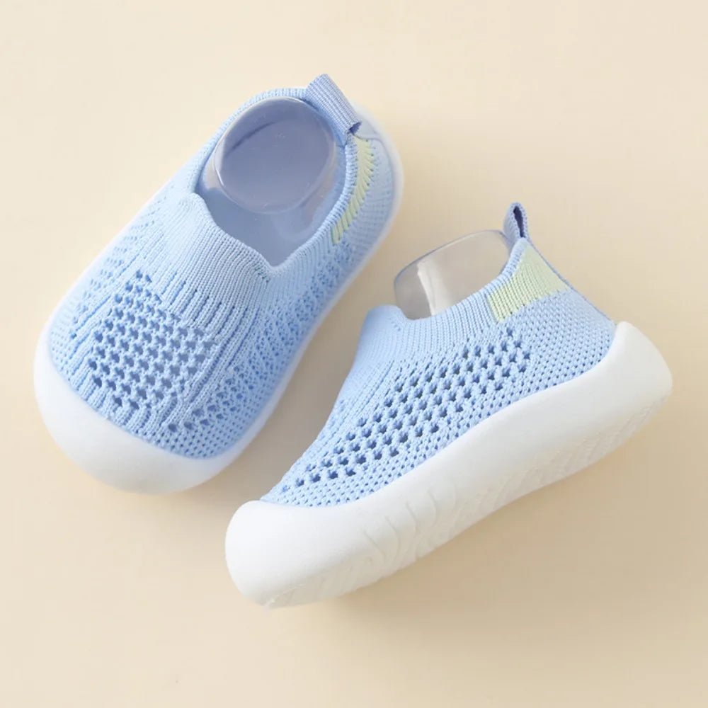 Light blue toddler mesh slip-on sandals with white cushioned sole