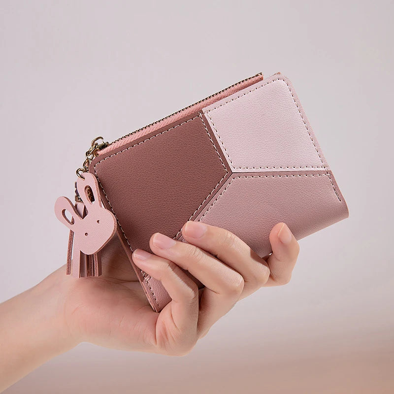 Compact PU leather wallet with keyring charm, stitched panels, and snap closure