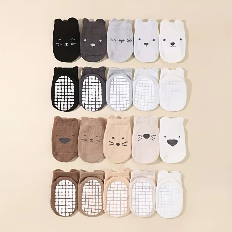 10-pack toddler socks with animal face prints and grippy mesh soles in dark, tan, and white