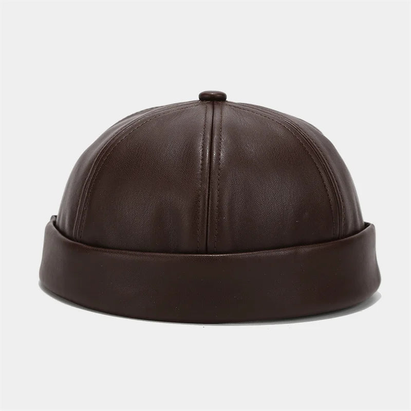Dark brown PU leather docker cap, rounded crown with stitched vertical seam and top button.