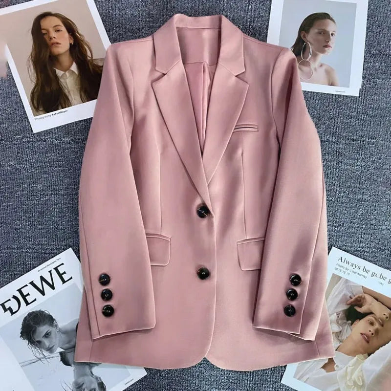 Women's tailored blazer in blush pink with notch lapels, flap pockets, four-button cuffs