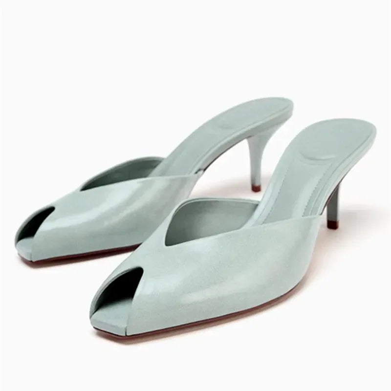 Women's light blue heeled slide sandals with open toe and slim stiletto heel