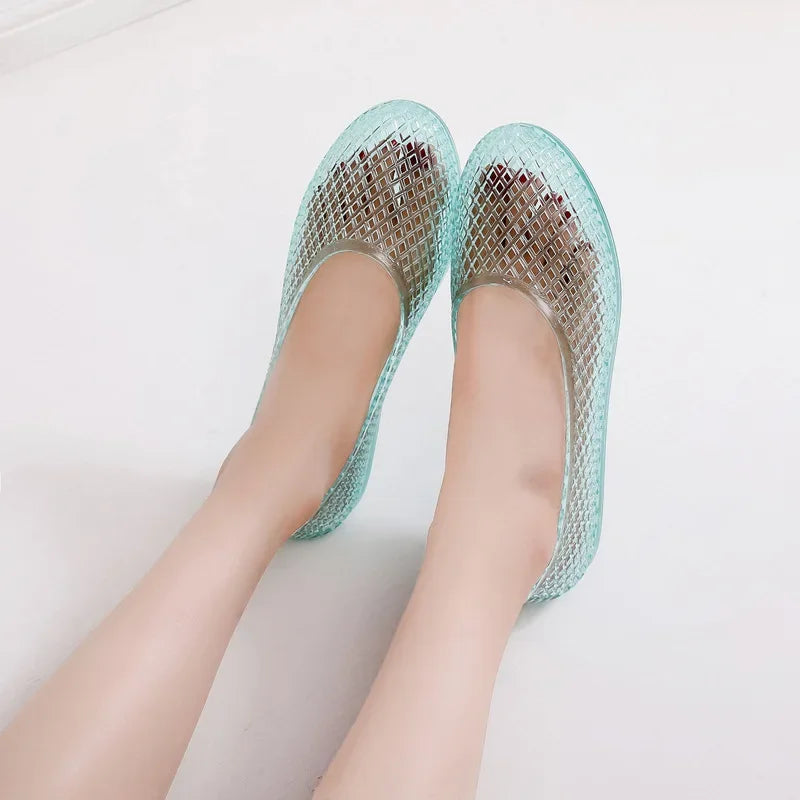 Light sky blue translucent jelly flats with mesh-style upper and slip-on fit