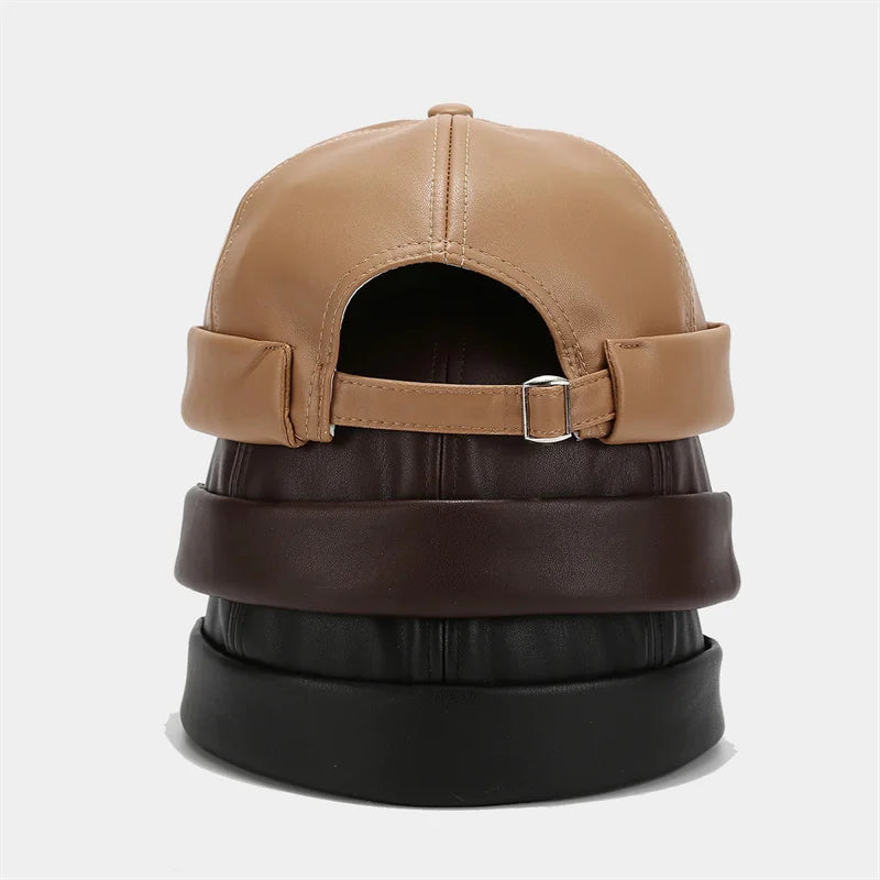 Unisex PU leather docker cap in tan with back strap and side buckle detail