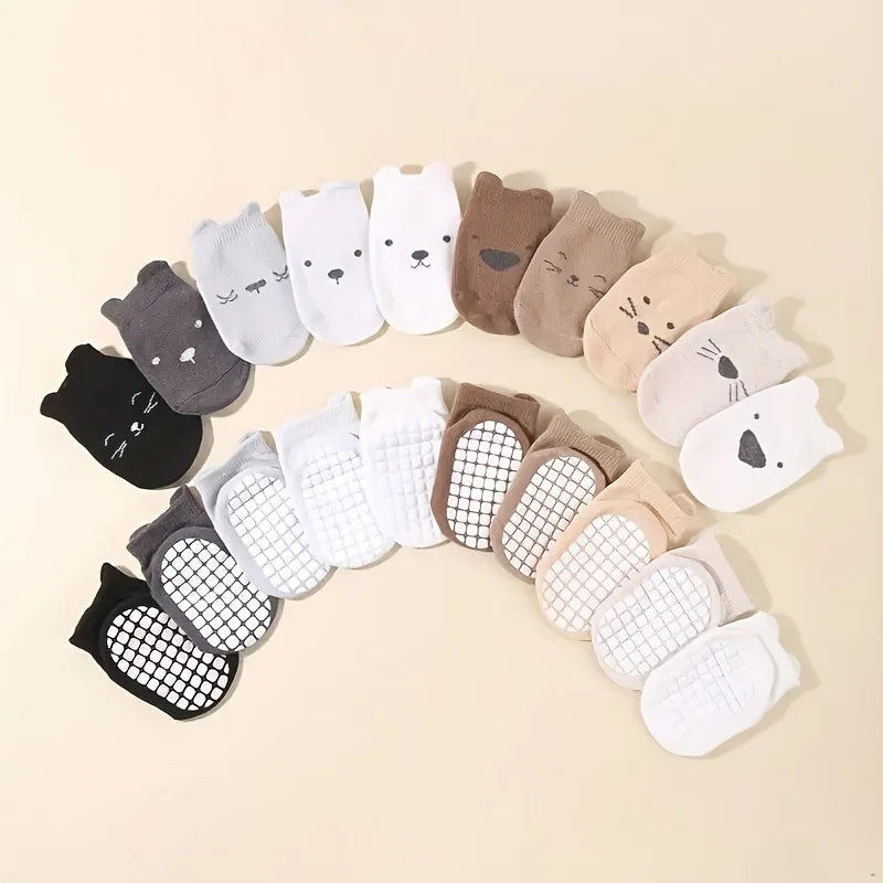 Baby crew socks 10-pack with animal faces and grippy mesh soles, mixed light and dark colors