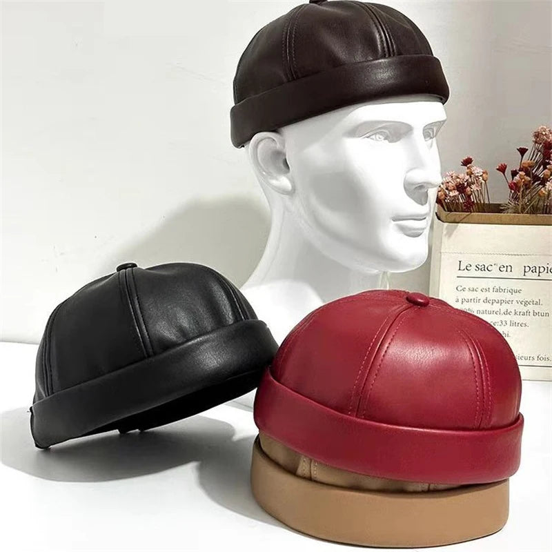 Unisex PU leather docker cap in dark brown/black with curved panel seams