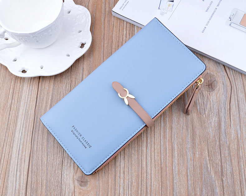 Long wallet purse, light blue with flap and bow clasp, gold zipper hardware