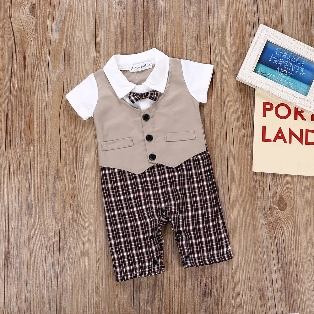 Infant boys’ gentleman suit romper with khaki vest, bow tie, and plaid shorts