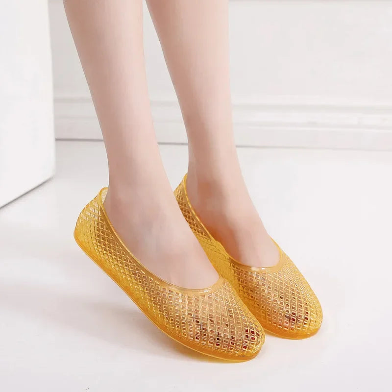 Yellow jelly flats, mesh-like upper, slip-on rounded toe