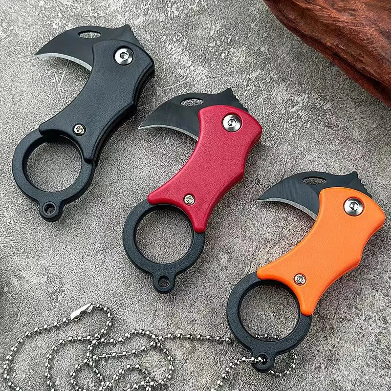 Mini folding pocket knife set with keychain rings, red, black, and orange handles