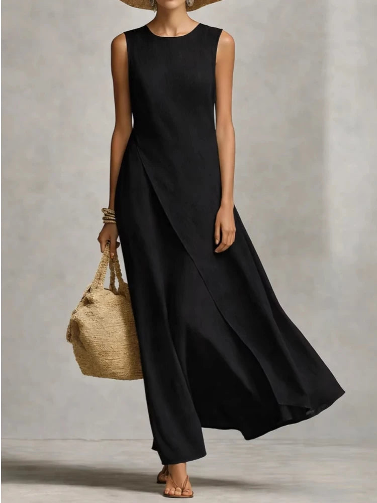 Black sleeveless maxi dress with draped front wrap and flared skirt hem