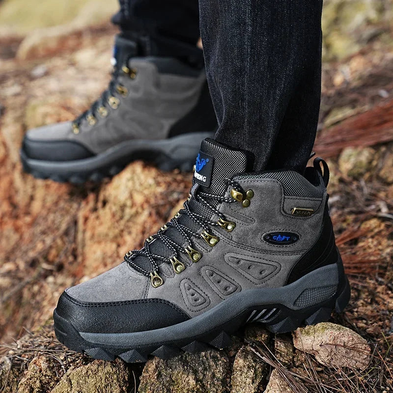 High-top adventure sneaker in grey and black, lace-up with rugged tread sole