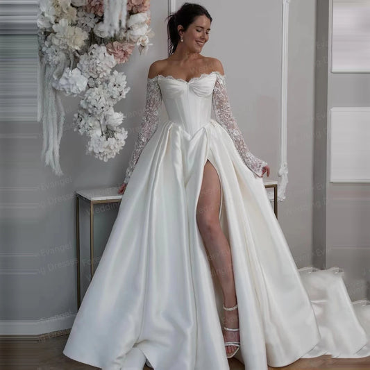 Off-shoulder sequined bridal gown with long lace sleeves and side slit skirt
