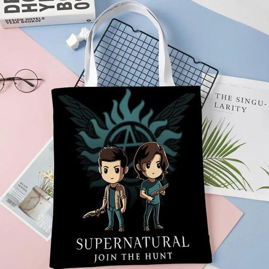 Black fabric tote bag with Supernatural character graphic and "JOIN THE HUNT" text