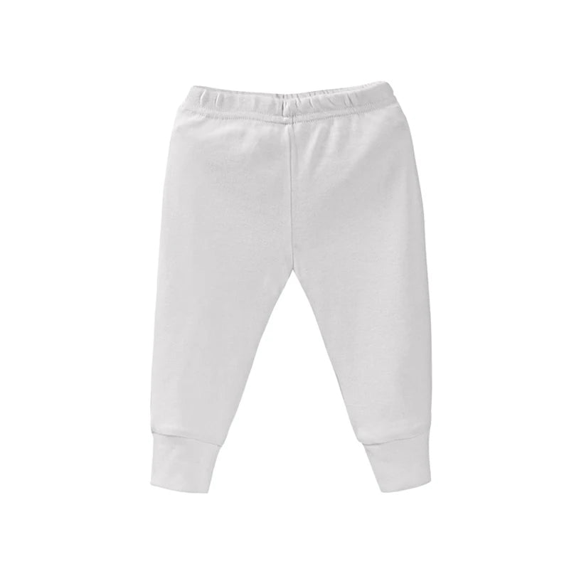 White baby jogger pants with elastic waistband and cuffed ankle hems