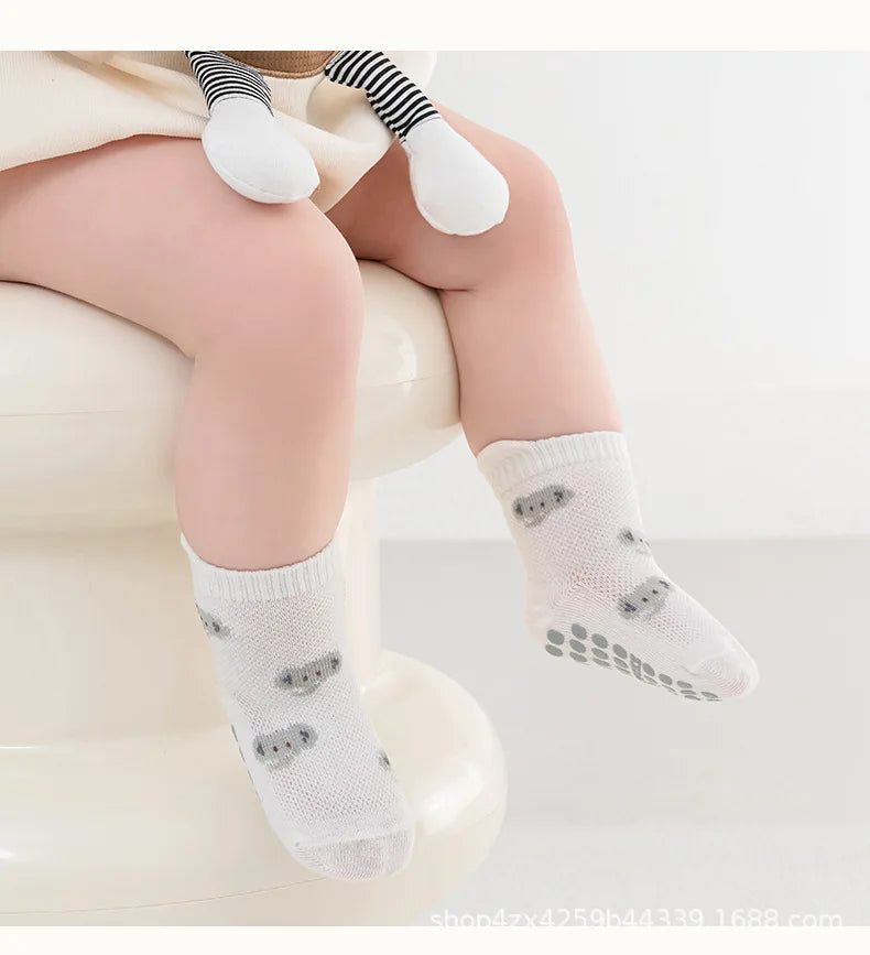 Non-slip baby floor socks in white with koala face and grippy toe dots