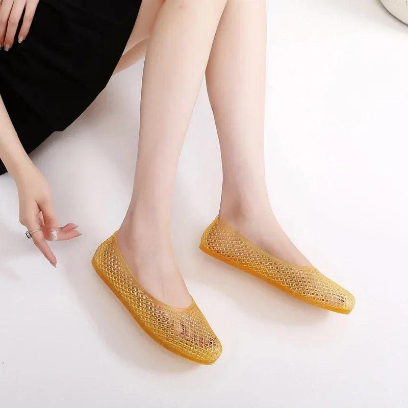 Yellow jelly flats with perforated mesh upper and slip-on low profile