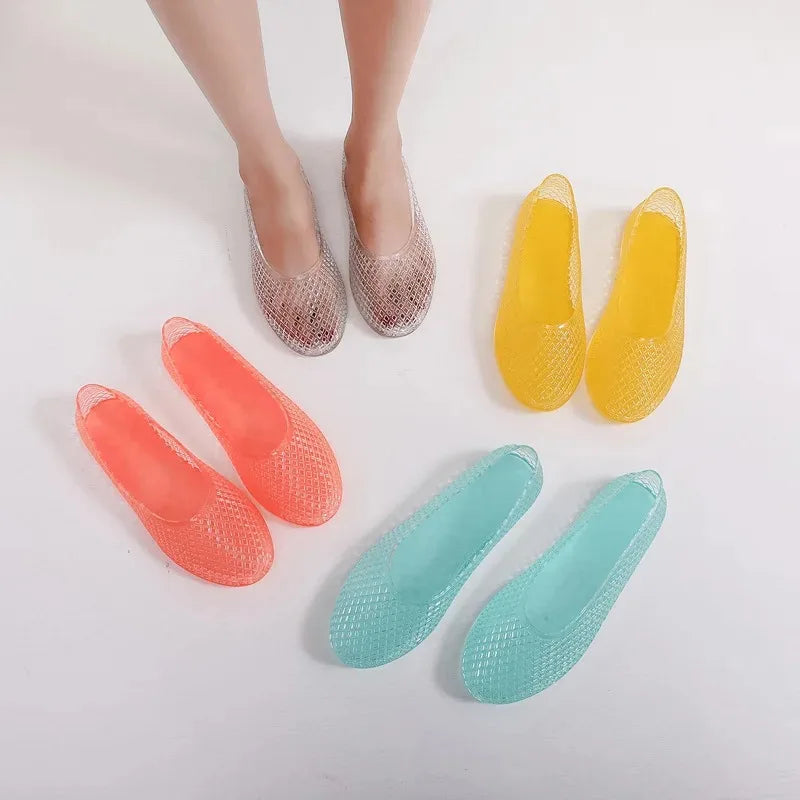 Set of jelly shoes in coral, peach, teal, and yellow mesh lattice flats