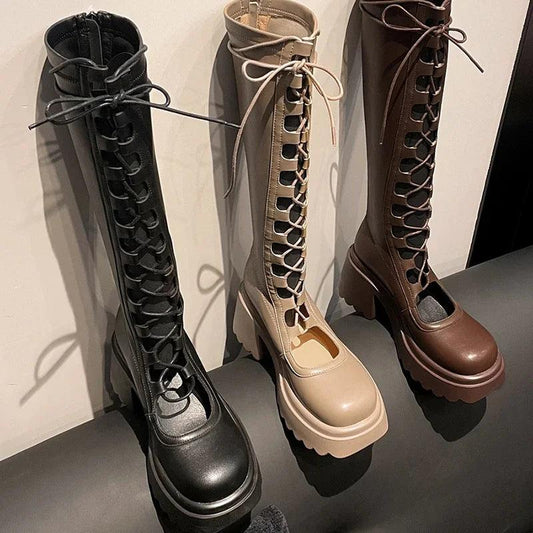 Black lace-up high boots with chunky platform sole and glossy finish