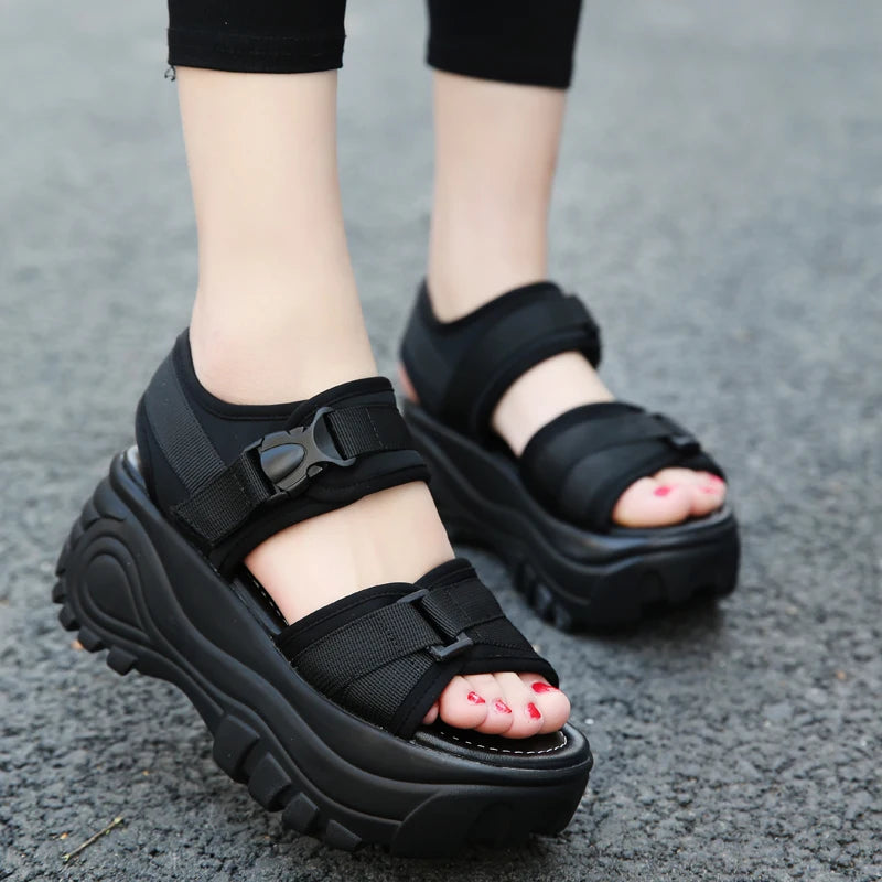 Black platform strappy sandals with adjustable buckles and open toe