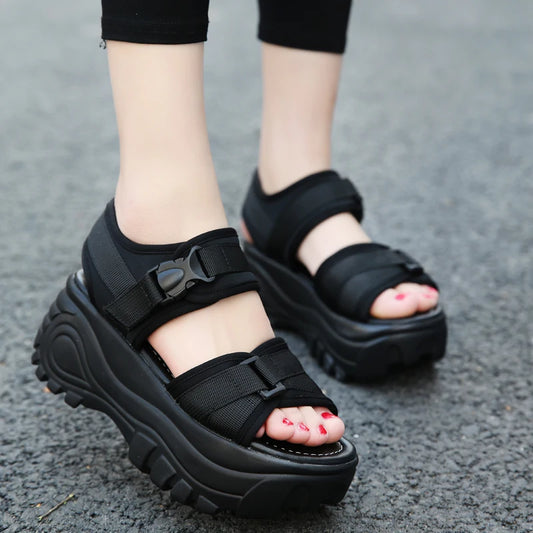 Black platform strappy sandals with adjustable buckles and open toe