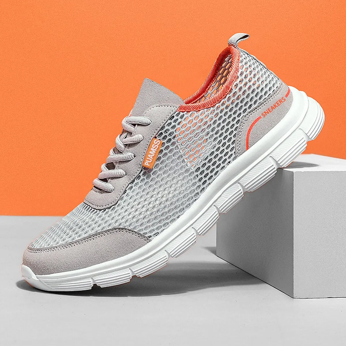 Light gray mesh lace-up sneaker with orange heel lining and white sole