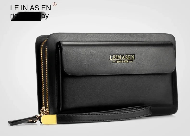 Black leather wallet angled view with front flap, double zipper edge, and wrist strap