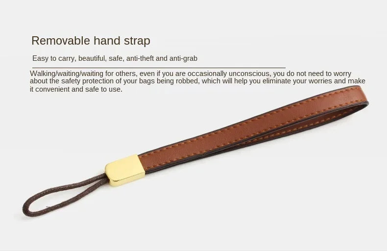 Brown wallet clutch with removable wrist strap and gold zipper trim