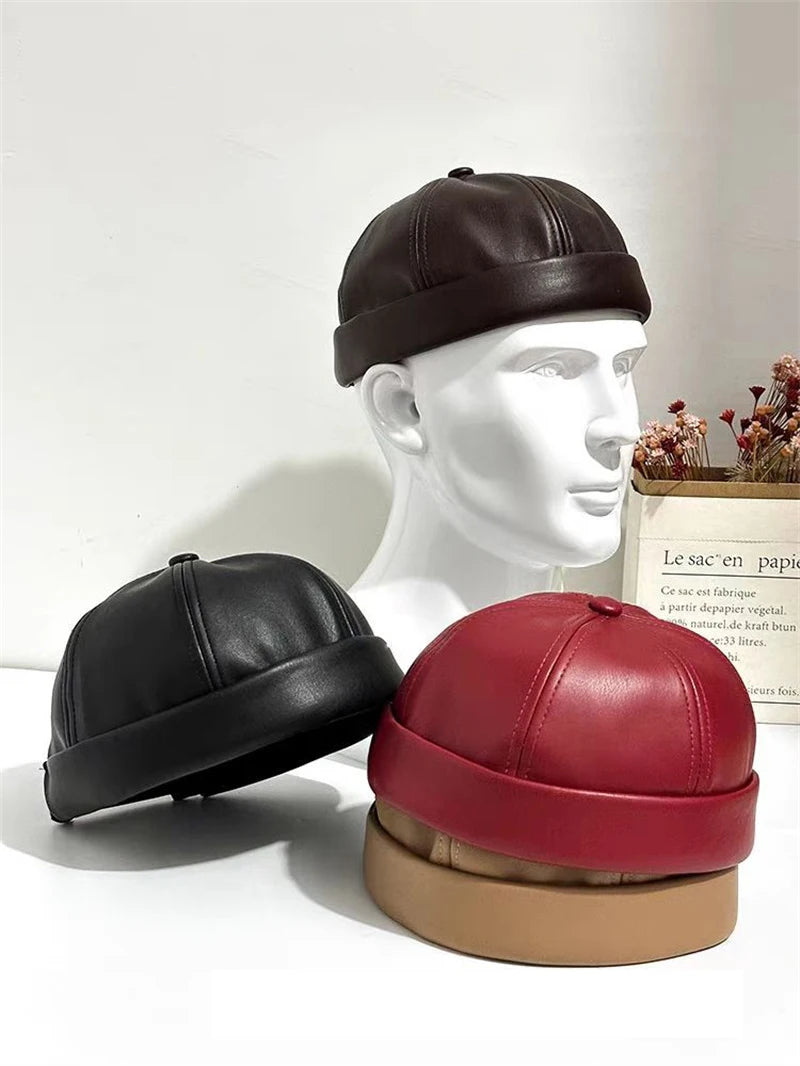Unisex PU leather docker cap set in black, red, and tan shown on mannequins