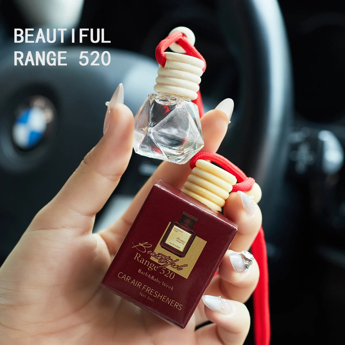 Hanging car air freshener bottle with red cord, Range 520 box in hand