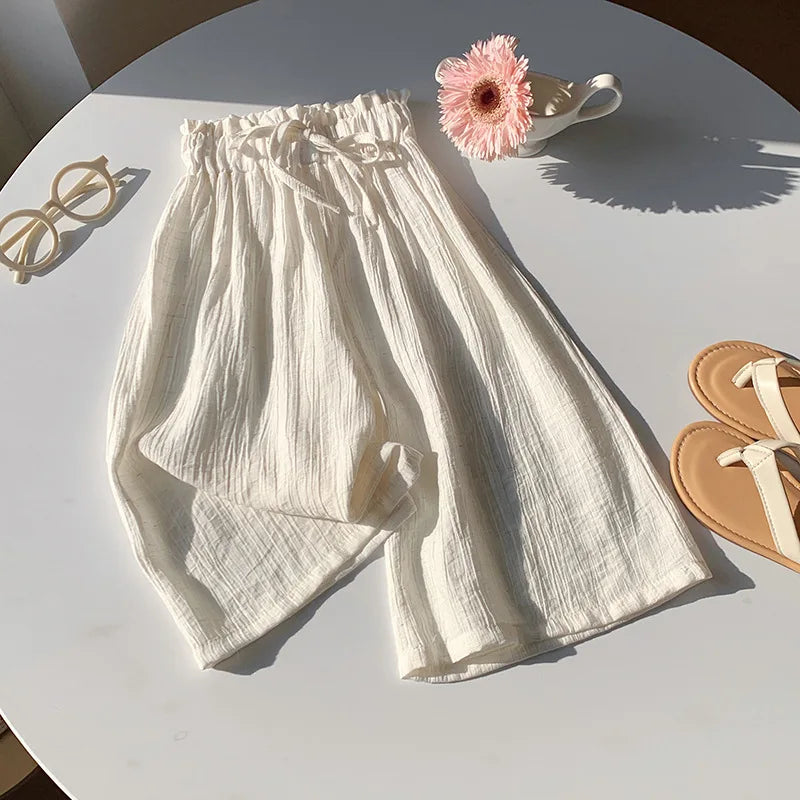 White toddler summer pants with elastic waist and gathered drawstring