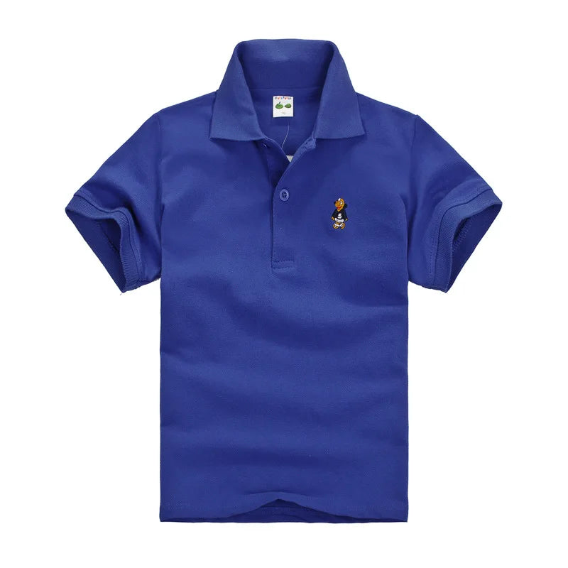 Boys royal blue short-sleeve polo shirt with small cartoon chest logo