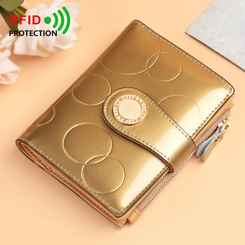 Gold patent short wallet card holder with circular pattern and gold emblem, snap closure