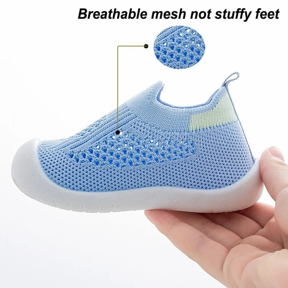 Blue toddler mesh slip-on sandals with elastic collar and white cushioned sole