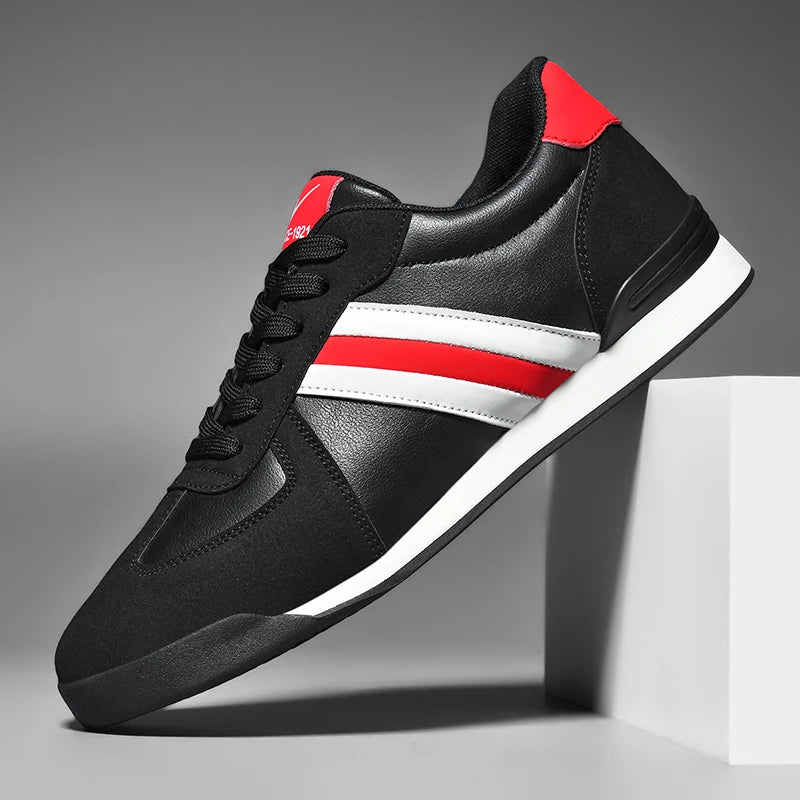 Retro black sneakers with red heel patch and white side stripe, side view