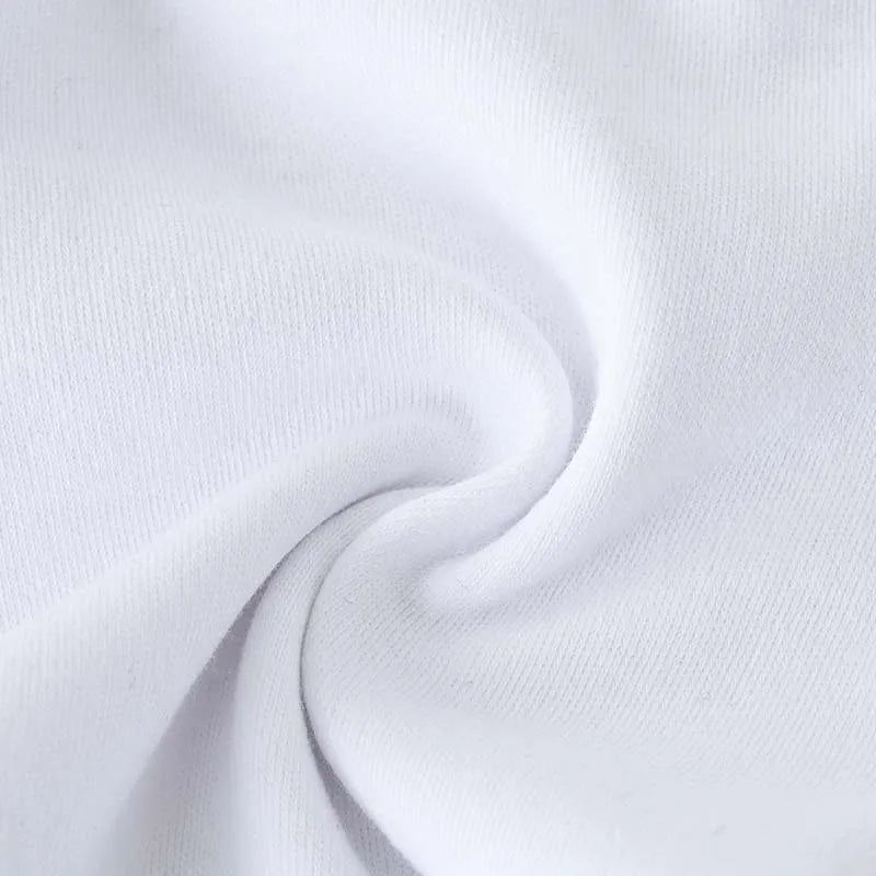 White baby jogger pants fabric close-up showing soft knit texture