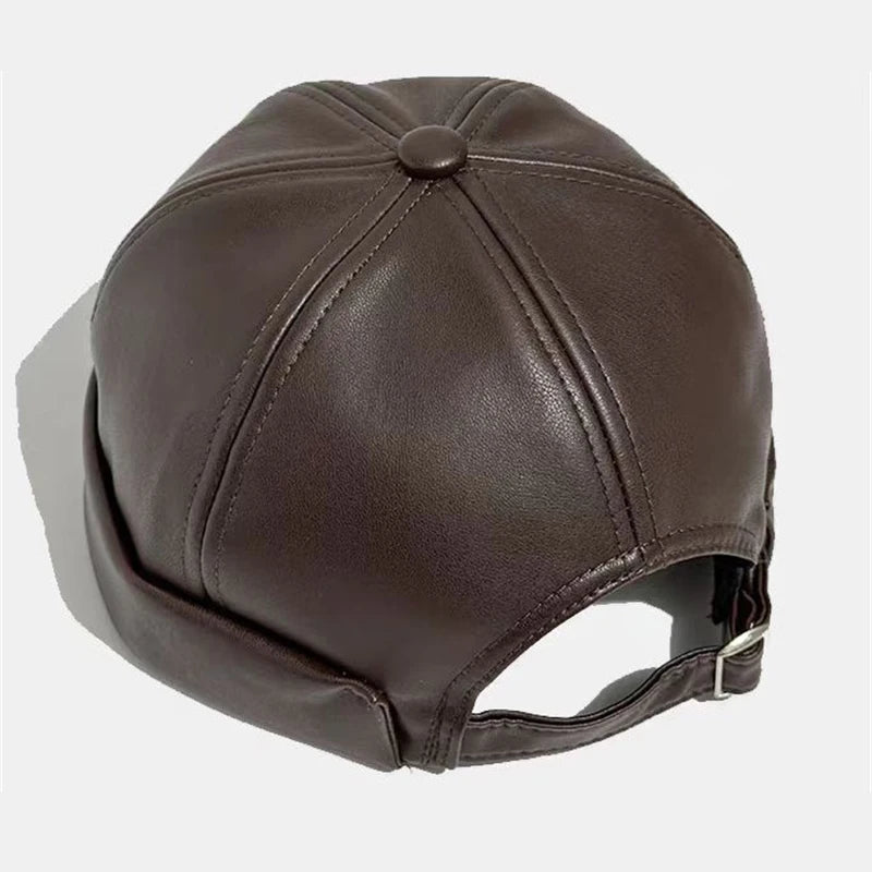 Unisex PU leather docker cap in brown with stitched paneling and adjustable strap