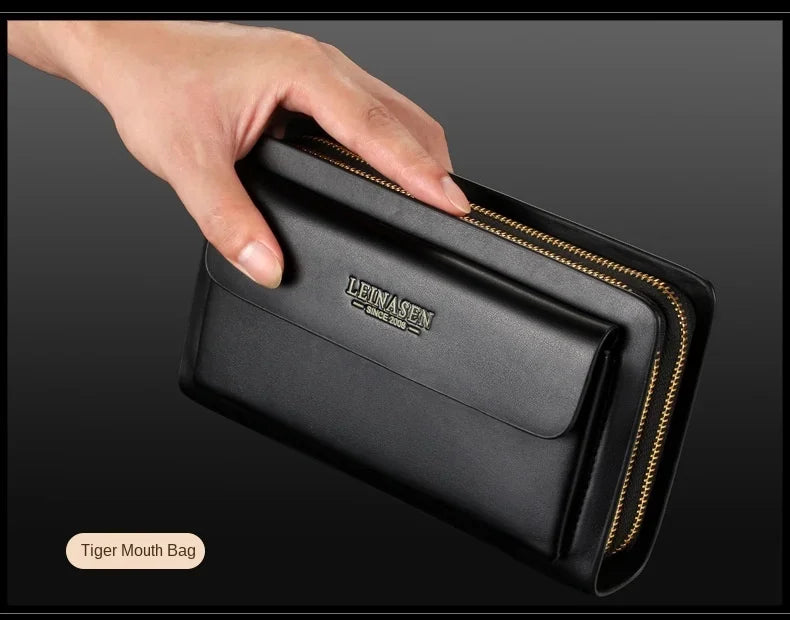 Black double-zip wallet clutch with money clip, held in an open palm