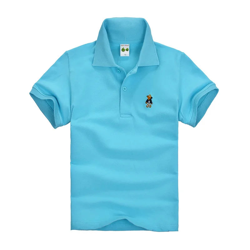 Boys light blue short-sleeve polo shirt with small cartoon chest logo