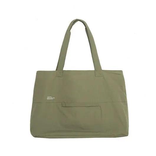 Green nylon office tote bag with two top handles and front flap pocket