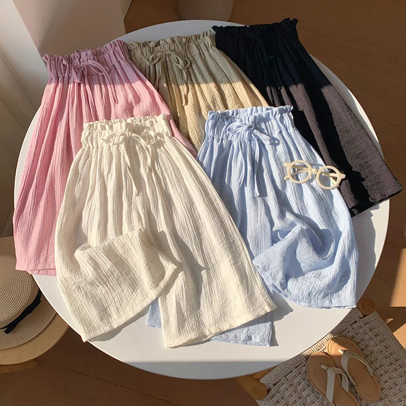 Pink toddler summer pants with elastic waist and gathered drawstring cuffs