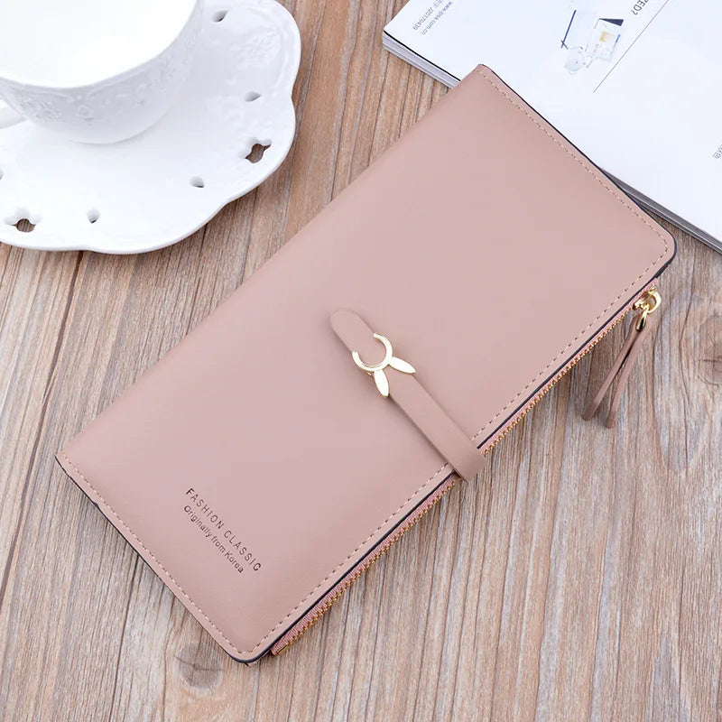 Long wallet purse, tan with flap and bow clasp, gold zipper hardware