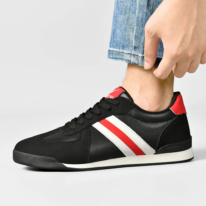 Retro black leather sneakers with white and red diagonal side stripe, lace-up