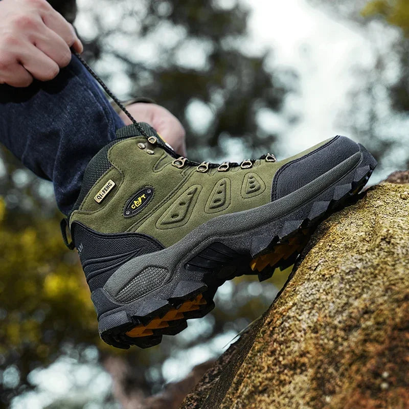 High-top adventure sneaker outsole with deep tread, olive green and dark accents