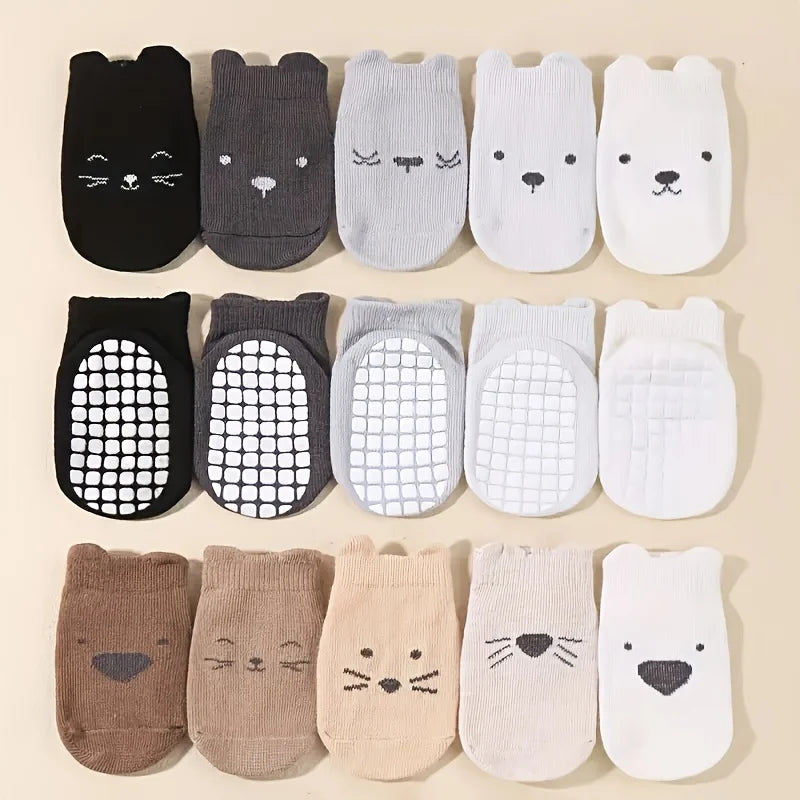 10-pack baby no-slip socks in black, gray, white, and tan with animal prints and mesh grippers