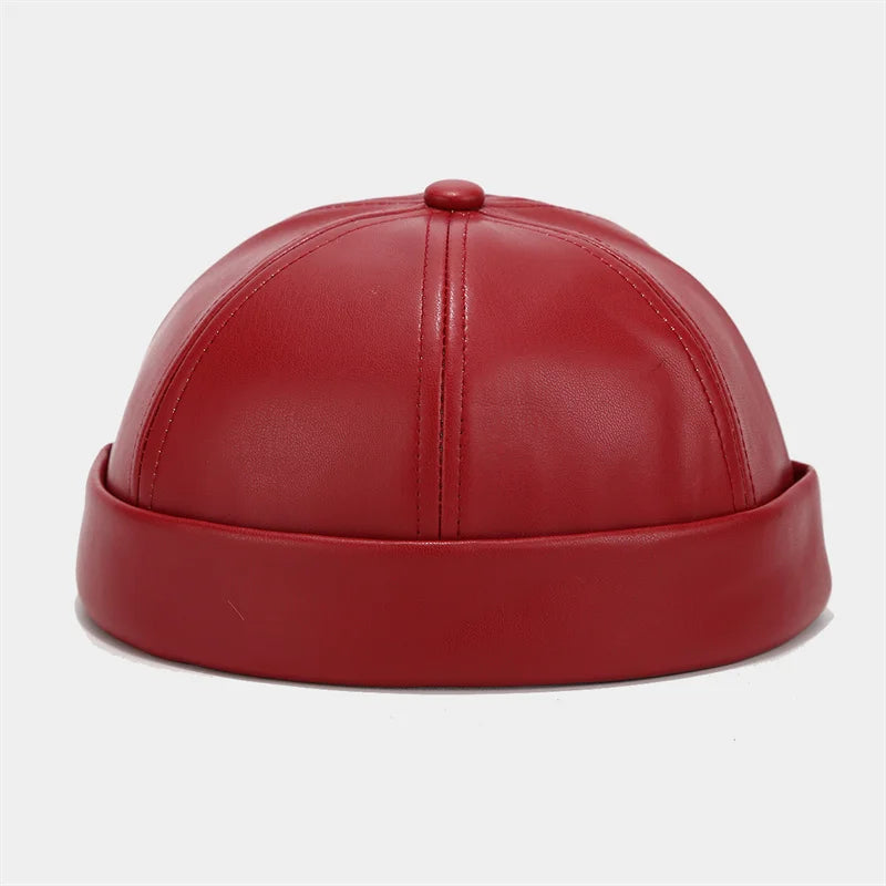 Red PU leather docker cap, domed crown with stitched center seam and top button.